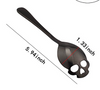 Black color skull teaspoon in stainless steel. 